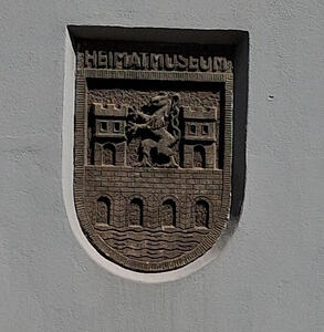 Seal of Bruck an der Mur, carved in side of Heimat Museum building.