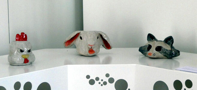 Head of a chicken, a rabbit, and a raccoon