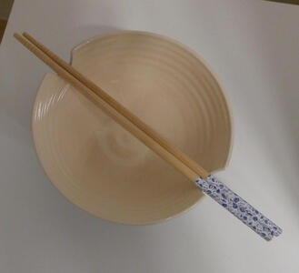 Top view of bowl showing chopsticks.