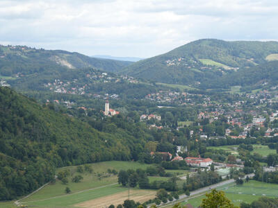 Long view of houses scattered throughout the foreground and background