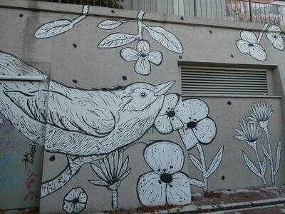 Black and white drawing of bird with flowers