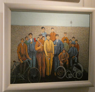 A group of workers standing in front of a wall. The man at the left has a bicycle.