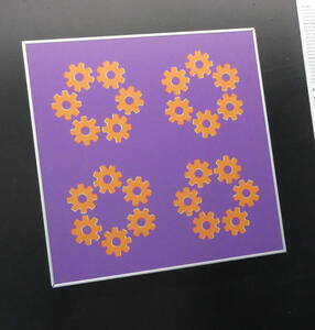 Picture of four sets of six gears which appear to rotate.