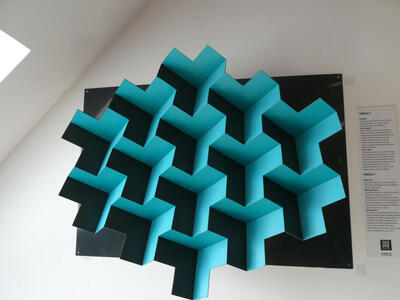 Y-shaped blocks. Your brain perceives the shadows as either concave or convex, and switches btween them.