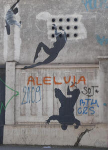 Silhouettes of people dancing in the air, and one person falling head first toward the ground.