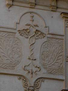 Caduceus with two entwined serpents with wings