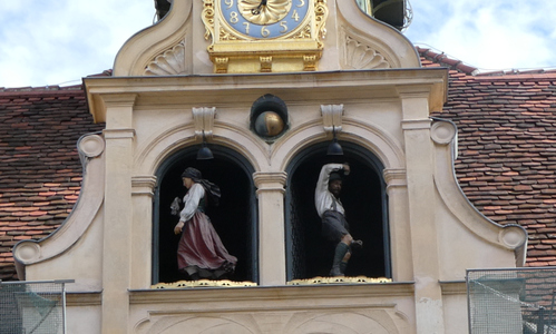 Figures of man and women dancers in doors of glockenspiel