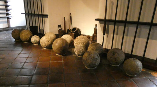 collection of cannonballs on floor