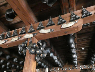 Powder horns and tools hanging from ceiling