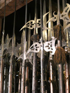 Spearheads with holes cut in the metal in geometric forms.