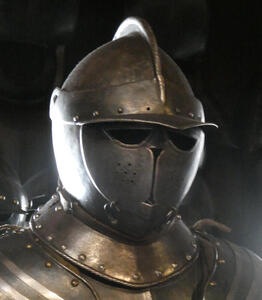 Armored helmet with a face that looks like a cat face.