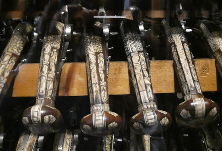 Pistol handles decorated with Adam, Eve, and Serpent motif