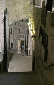 View of a lower level with more tile fragments and a statue