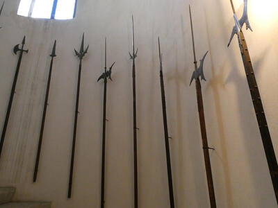 Long-handled pikes mounted on wall