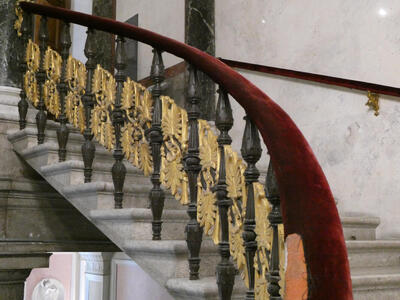 Gold decoration on the balusters of a staircase