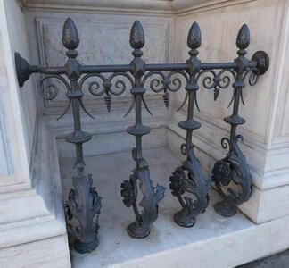 Metal fence with decorative bottoms and pointy tops and sides