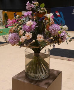 Bouquet with mostly purple and light orange flowers
