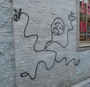 Stick figure of man with wavy lines for arms and legs and a shocked/sad expression on his face