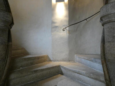 Two stairways joined at center; one angles up to left, the other up to the right