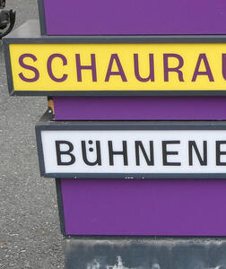First part of a word BÜHNEN... with the umlaut vertically placed inside the U.