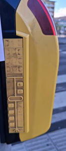 Four lanes closest to person, traffic island in middle, and two lanes the other direction