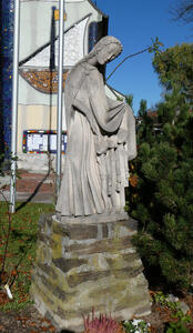 Statue of St. Barbara, head tilted to right.