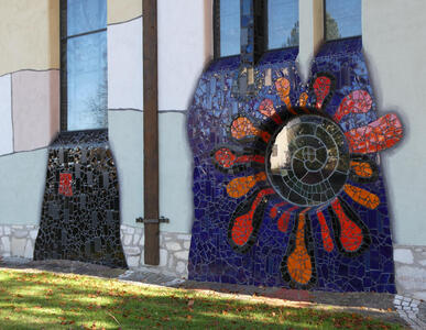 Red and orange mosaic patterns around a circular window; the result looks like a flower
