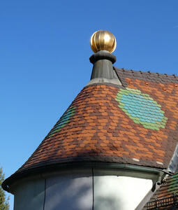 Church roof, tiles in green and light blue form an octagonal pattern.