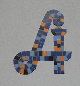 Mosaic Apotheke symbol in shades of blue, with orange and black highlights