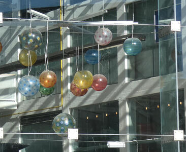 Multicolored glass spheres hanging from ceiling