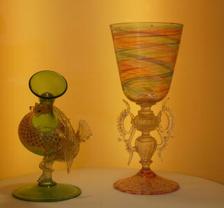 Two glass flagons with a dragon motif on the handles and near the base.