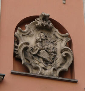 Carving showing Mary holding baby Jesus.