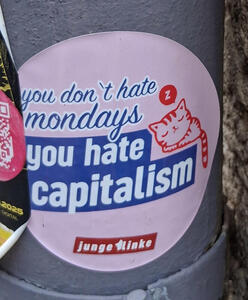 Drawing of sleeping cat. Text: you don’t hate mondays,  you hate capitalism (junge linke)