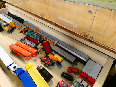 Drawer containing model railway cars of various styles and colors