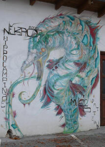 Wall painting of a dragon-like creature.