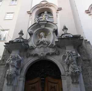 Front of church; large reliefwork above door is the saint with arrows in his body