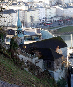 View from terrace; at left, church spire. at right, the river. Steep hill in foreground