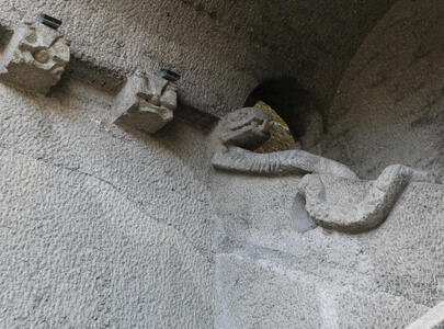 Stone carving on staircase that looks like a snake