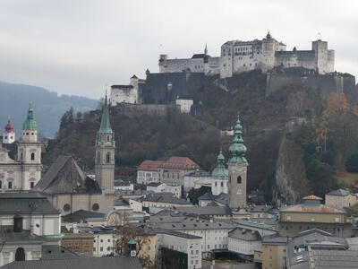 View of city (in foreground) and fortress in background.