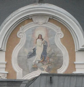 Painting surrounded by scrollwork. Painting is of Jesus, with a ray of light from heaven shining on him.