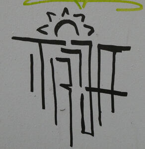 Graffiti with an artist’s signature under a rising sun with v-shaped rays