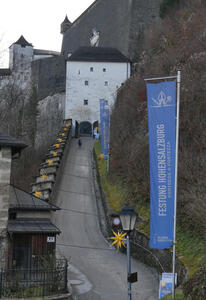 Steep ramp up to fortress. At side, christmas stars are placed at regular intervals