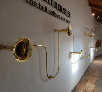 Brass instruments (like trumpet horns) connected with tubing