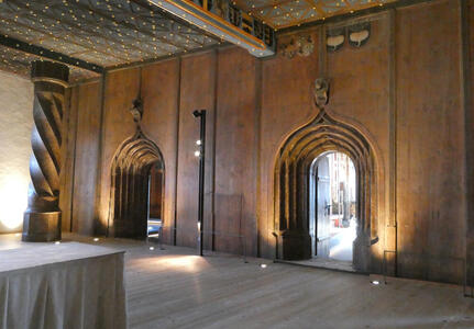 Elegant room with wooden arches that appear to be “nested”