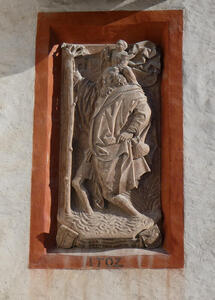 Man holding on to tree, cherub on his shoulder. Dated 1502? in old medieval numerals
