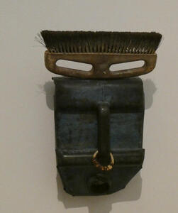 An “african mask” with a broom brush for the hair and eys, and a piece of ordinary metal with a handle as the nose and mouth.