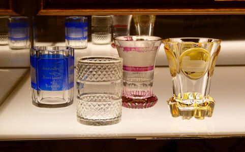 Glassware with blue, red, and yellow decoration.