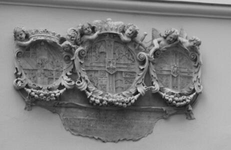 Three carved heraldic shields