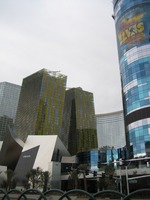 Long view exterior showing 'leaning buildings' and blue tower