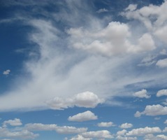 Puffy clouds with 'nebula' in background